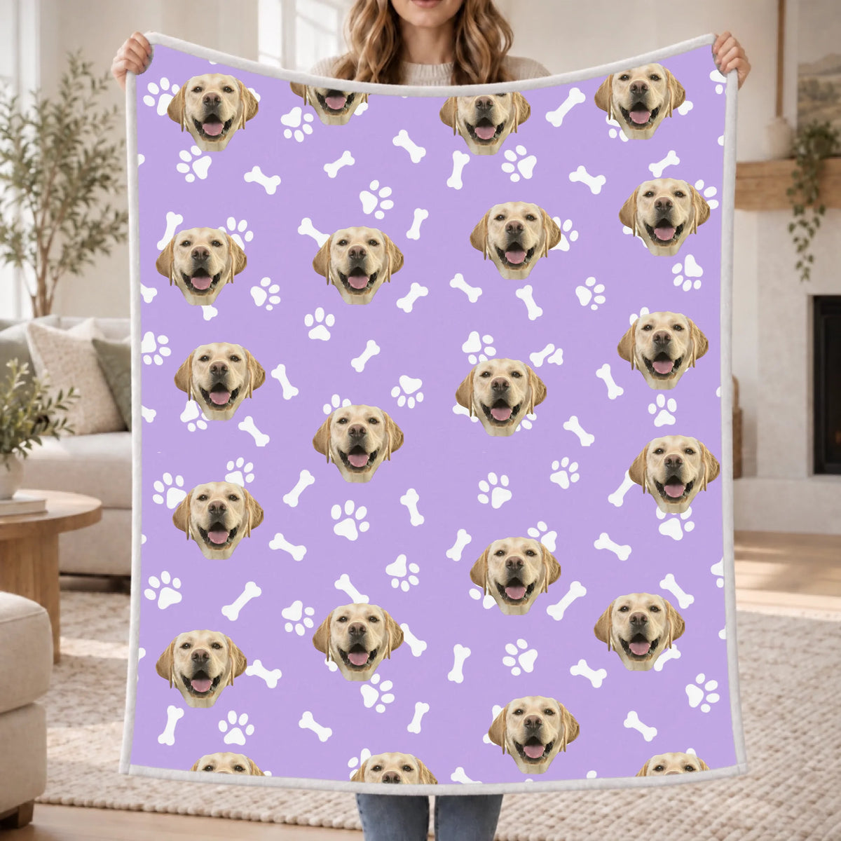 Woman holding a draped personalized blanket
