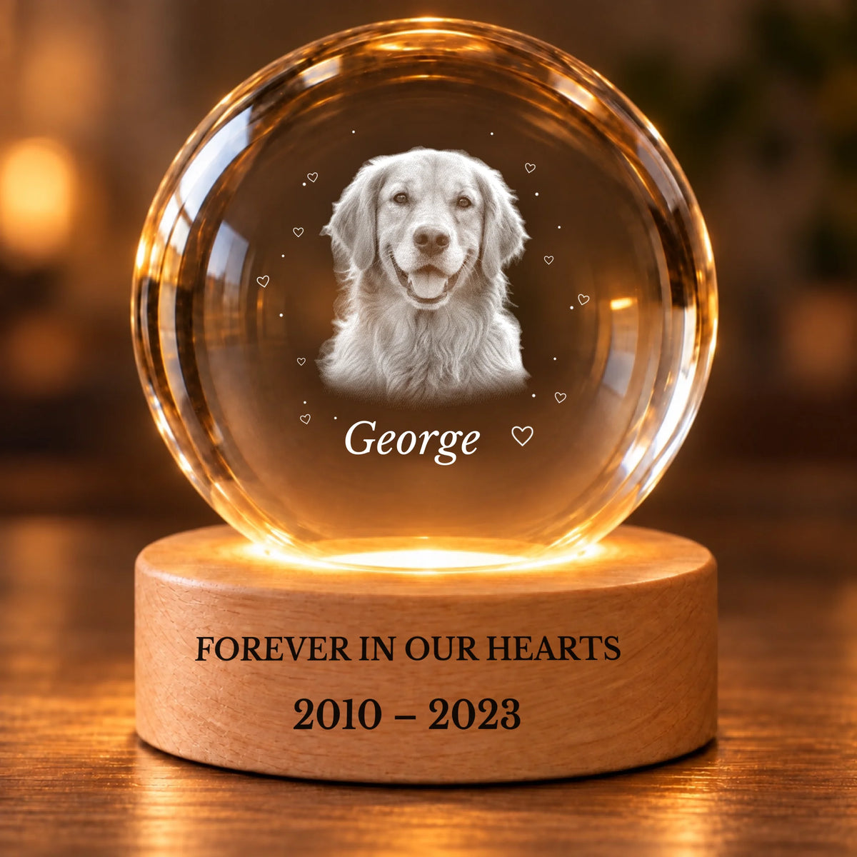 Close-up personalized pet memorial crystal ball with engraved wooden LED base