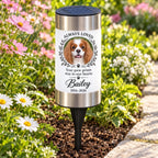 Personalized pet photo solar garden light in a daytime flower garden