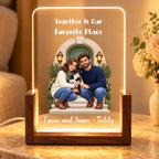 Walnut personalized family and pet acrylic night light on a travertine table with flowers