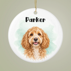 Close-up of a white ceramic pet ornament with a watercolor dog portrait, Parker name and soft mint background.