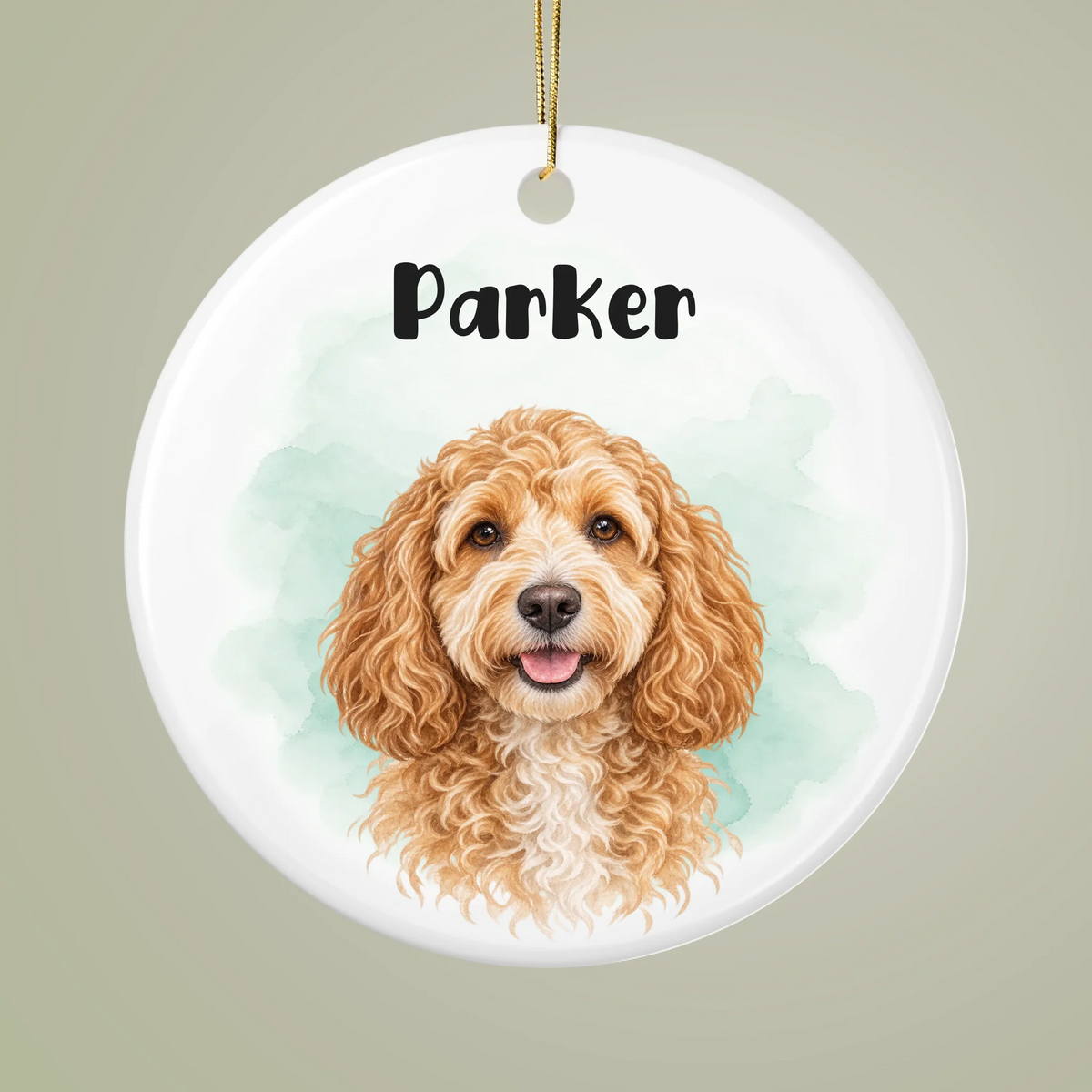 Close-up of a white ceramic pet ornament with a watercolor dog portrait, Parker name and soft mint background.